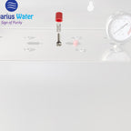 Aquarius Wellness pressure relief button for whole house water filtration systems, shown in a close-up of the device.